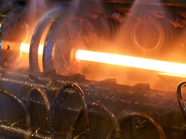 Carbon steel seamless pipe production method